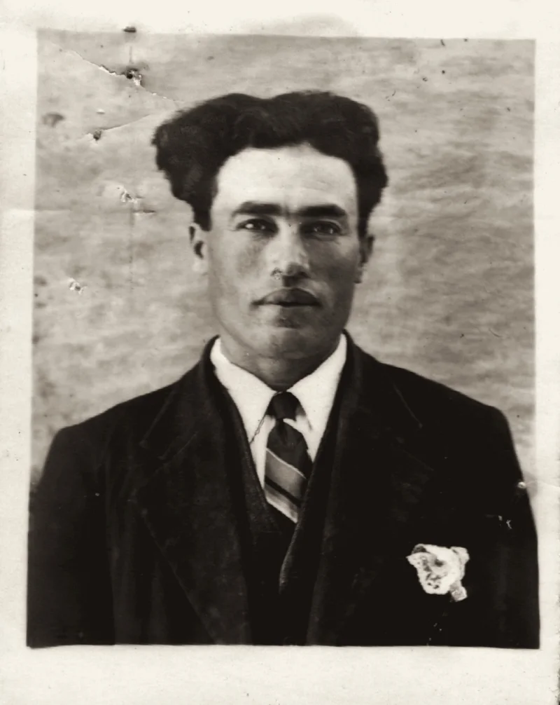 Passport photograph of a young man in a jacket and open-collared shirt, taken in 1936.